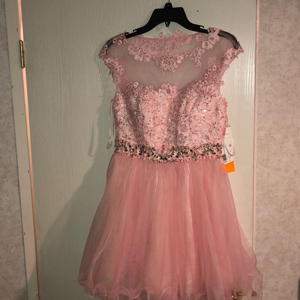 A baby pink short prom dress